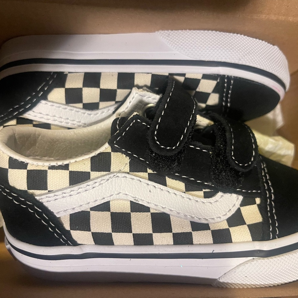 Vans Black and White Checkerboard Slip-On Sneakers